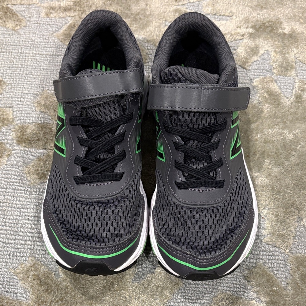 New Balance Kids Black and Green Sneakers, worn one time. Size 1 1/2 like new